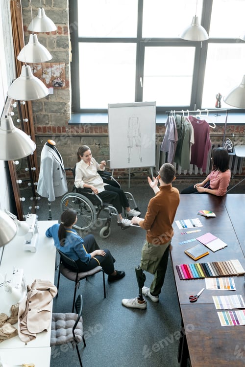 Preview: Designers discussing sketchc on whiteboard in workshop