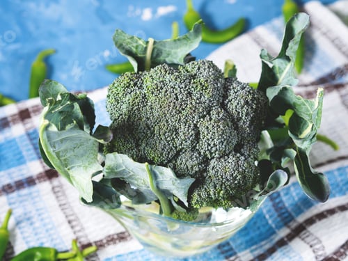 Preview: Raw green fresh broccoli vegetable on napkin
