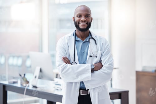Preview: Science is the tree of wisdom. Shot of a young doctor standing alone with his arms folded in a lab.