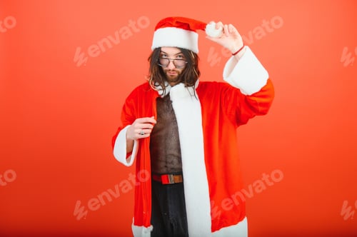 Preview: New Year's gay party. A gay man in a Santa suit. LGBT concept.