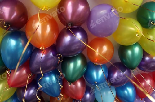 Preview: Colorful bright balloons filled with helium hang from the ceiling