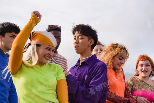 Preview: Group of multiracial young people dancing at music festival outdoor during summer time