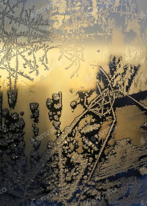 Preview: Beautiful ice pattern and sunlight on winter window glass