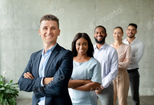 Preview: Diverse Successful Businessman And Businesswoman Posing Together Over Grey Wall In Office