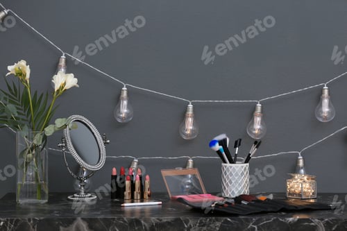 Preview: Decorative cosmetics and tools on dressing table in makeup room