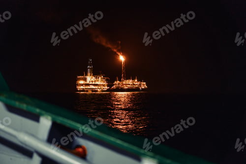 Preview: Night view of FPSO tanker vessel near Oil Rig