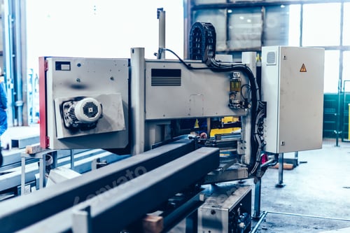 Preview: Saw machine for cutting steel profiles in a factory,