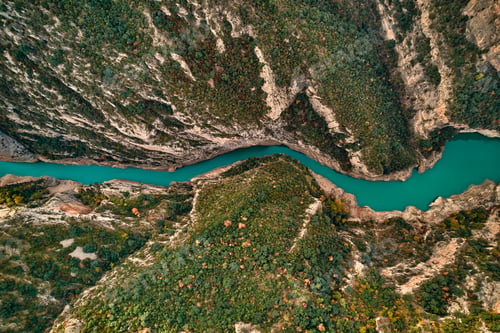 Preview: River flows through a canyon in a natural landscape surrounded by trees