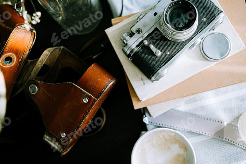 Preview: Vintage old Soviet photo camera with book on table
