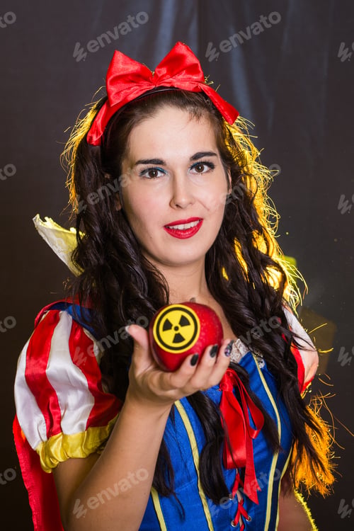 Preview: Woman holding hazardous radioactive apple. Nuclear and radiation measurement concept