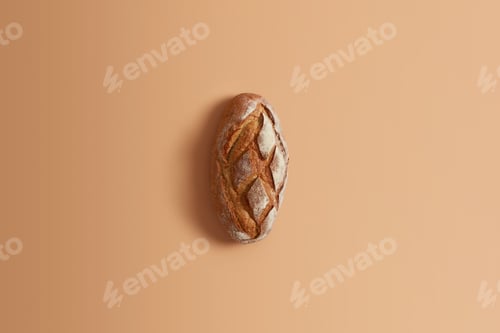 Preview: Fresh homemade wheat bread made of whole rye isolated on beige background. Whole loaf for your consu