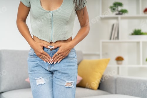 Preview: Woman touching her belly feeling menstruation pain
