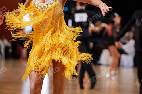 Preview: female dancer in yellow dress in dance competition