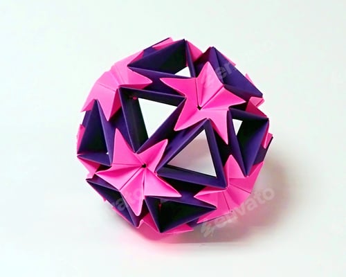 Preview: Origami ball made of pink and purple colors paper on white background