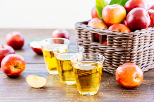 Preview: Apples juice in glass with apple in the basket