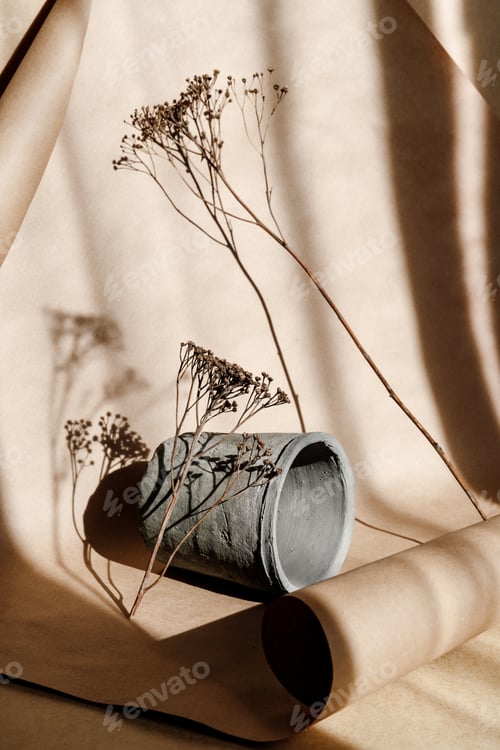 Preview: Abstract creative minimal composition with a clay pot and dry grass
