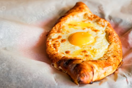 Preview: Ajarian khachapuri Georgian cheese pie with egg close