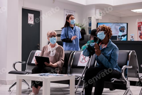 Preview: People Waiting in Hospital Wearing Face Masks