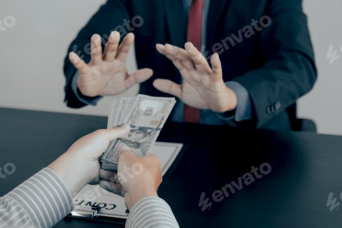 Preview: Businessman hand give the bribe to government officials who raise the hand refusing money