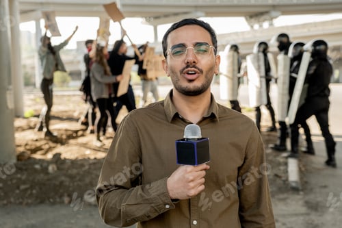 Preview: Young journalist speaking into microphone