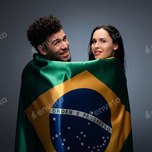Preview: multicultural couple of positive football fans with brazil flag on grey