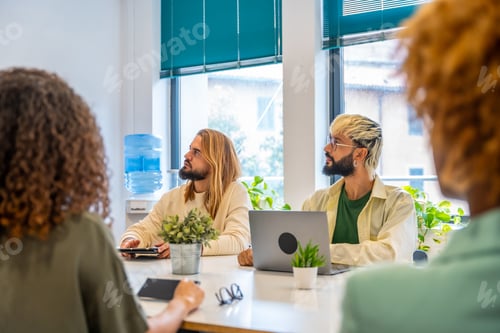 Preview: Coworkers paying attention to a speech of a colleague