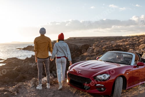 Preview: Lovely couple traveling by car near the ocean