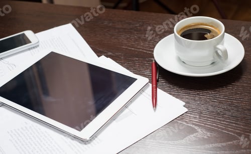 Preview: Workplace of businessman with digital tablet, smartphone, Cup of coffee and charts.