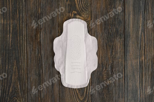 Preview: Menstruation period concept. Hygienic white female pad.