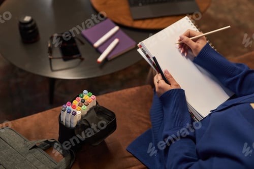 Preview: Woman Drawing Sketch on Blank Paper