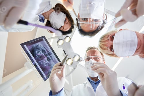 Preview: Medical Team In The Dental Clinic Of Maxillofacial Surgery In Protective Clothing With Various