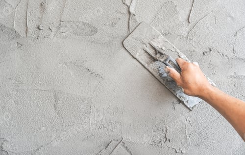 Preview: Hand Smoothing Cement with Trowel on Wall
