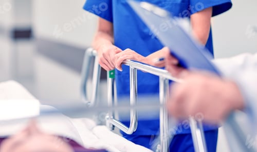 Preview: medics and patient on hospital gurney at emergency
