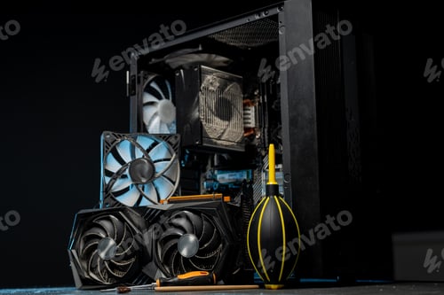 Preview: Cleaning the computer video card from dust with a brush and air. Computer fans in dust