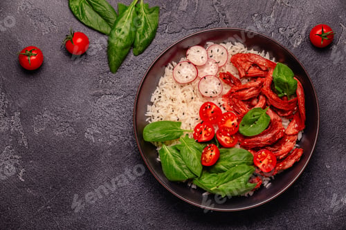 Preview: Bowl with vegan fried soy meat and vegetables served with boiled rice.