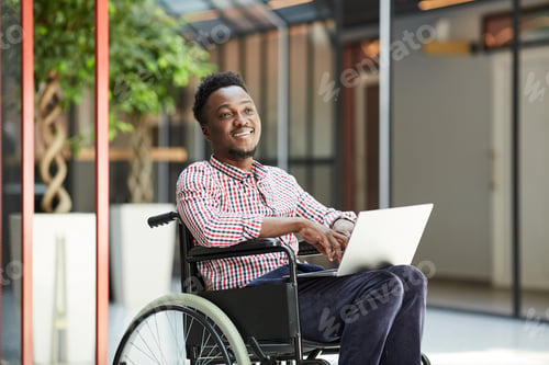 Preview: Disabled man using laptop