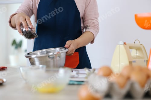 Preview: Woman Hands Adding Chocolate Chips