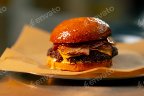 Preview: a Delicious fresh cheeseburger on plate with old grey background Fresh american kitchen