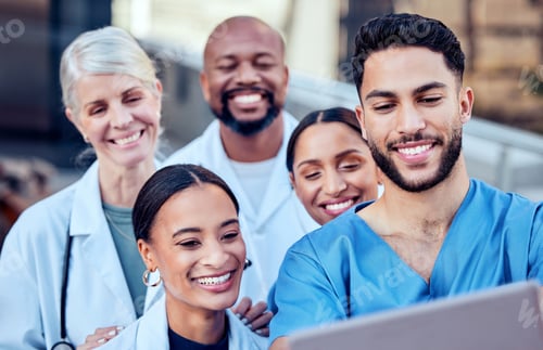 Preview: We make a great team. Shot of a group of doctors taking a selfie in the city.