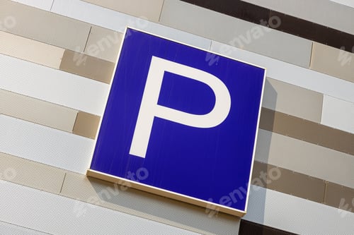 Vista previa: Close-up of european parking sign on metal striped wall of different light colors