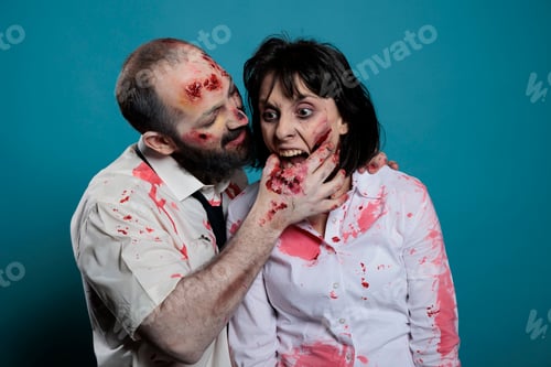 Preview: Undead zombies biting hand on camera