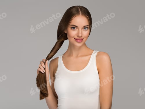 Preview: Attractive Woman with Long Brown Hair in Studio