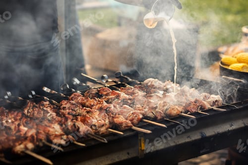 Preview: Delicious bbq kebab grilling on open grill, outdoor kitchen