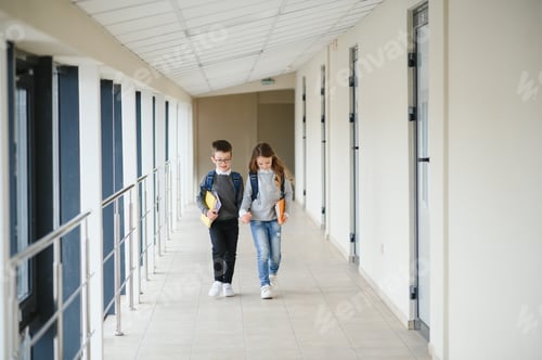 Preview: Cute pupils running down the hall at the elementary school