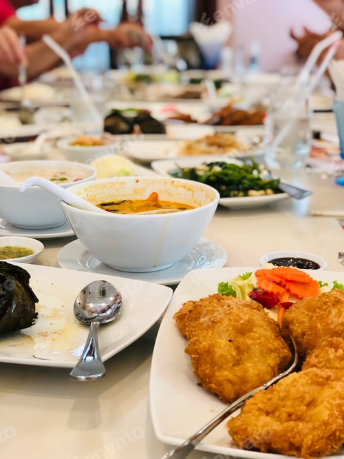 Preview: Dining table with delicious food closeup on table blur background
