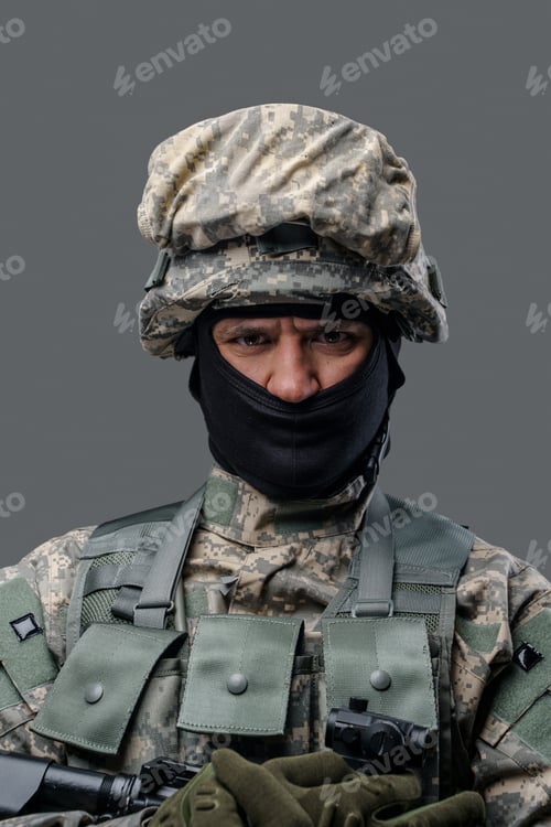 Preview: Headshot of bravery soldier dressed in uniform holding rifle