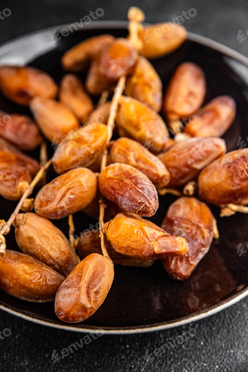Preview: date on a branch dried sweet fruit fresh appetizer meal food snack on the table copy space food