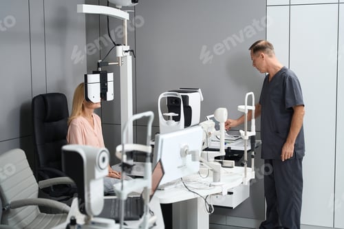 Preview: Young woman sitting and having examination in clinic