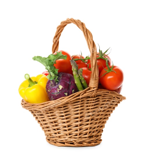 Preview: Fresh ripe vegetables in wicker basket on white background