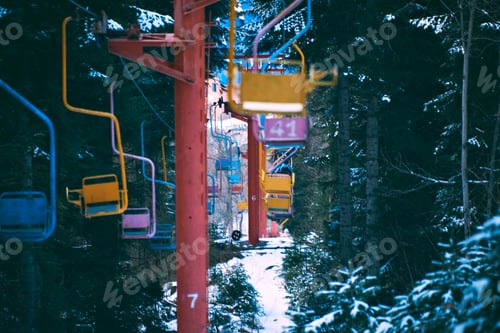 Preview: Old vintage ski lift with colorful chairs